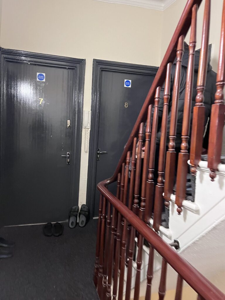 Staircase and landing at 267 Ballards Lane before its conversion from a shared house to offices